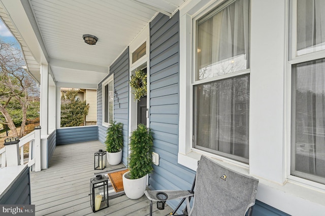 wooden terrace with a porch