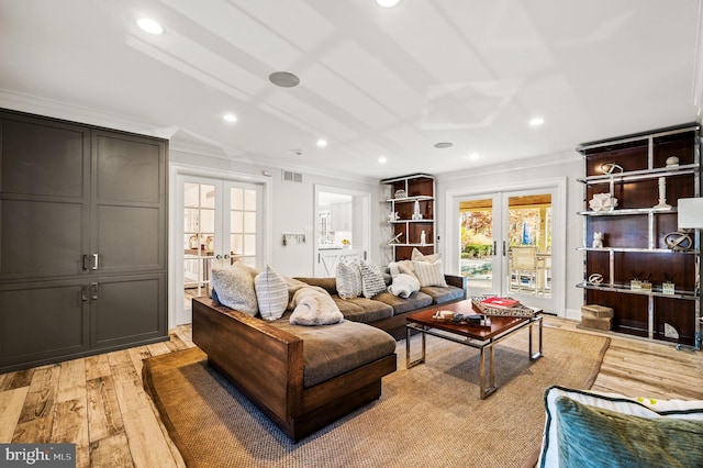 living area featuring french doors, light wood-style floors, and ornamental molding