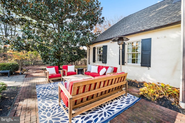 wooden terrace featuring outdoor lounge area and fence