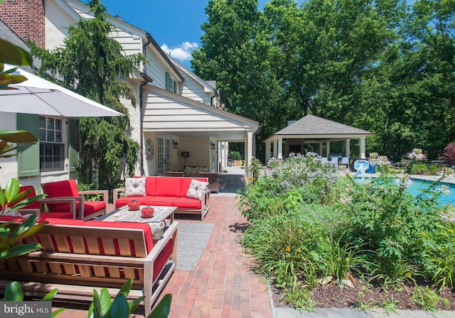 view of patio with a gazebo and an outdoor living space