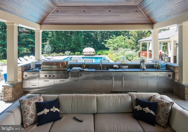 view of patio with a gazebo, a grill, outdoor lounge area, and a sink