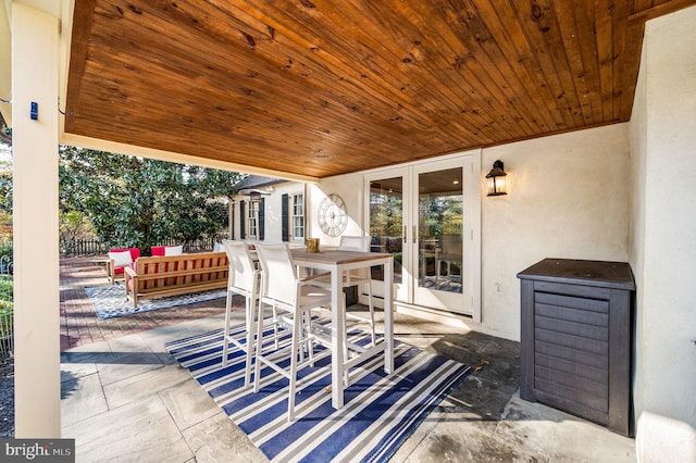 view of patio featuring outdoor dining space and french doors