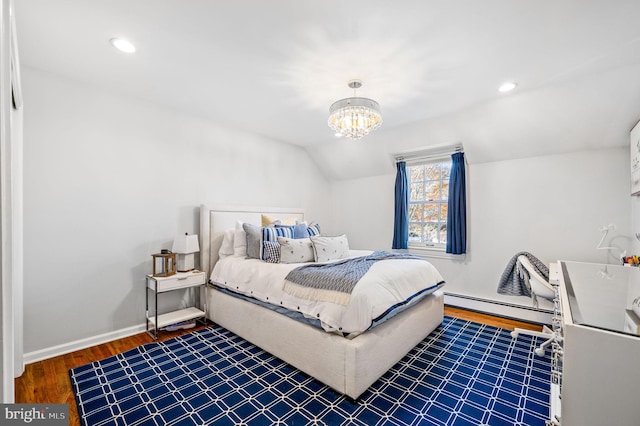 bedroom featuring a baseboard heating unit, baseboards, a chandelier, lofted ceiling, and wood finished floors