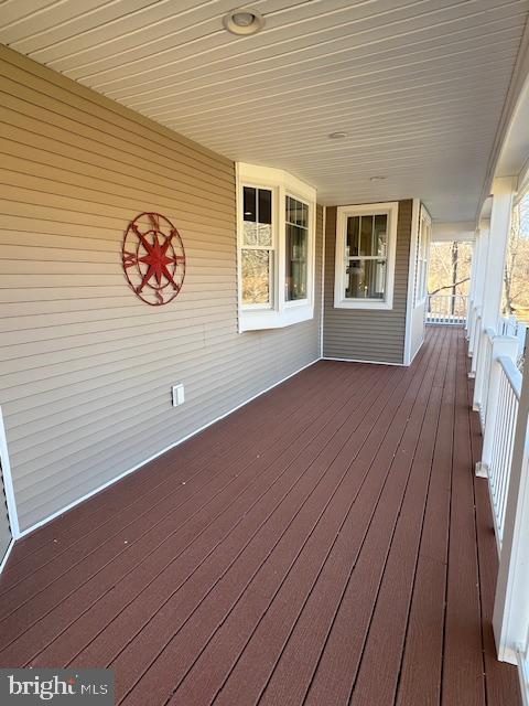 wooden deck featuring covered porch