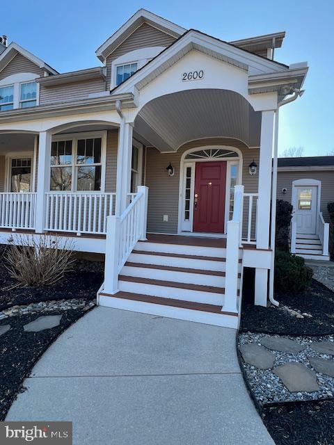 doorway to property featuring a porch