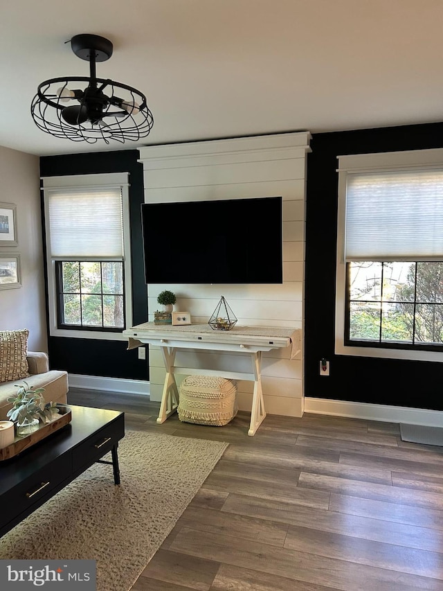 living room with wood finished floors and baseboards