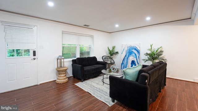 living room with visible vents, recessed lighting, crown molding, and wood finished floors