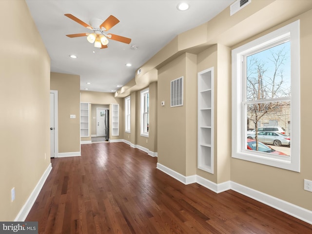 foyer with recessed lighting, baseboards, visible vents, and dark wood-style flooring