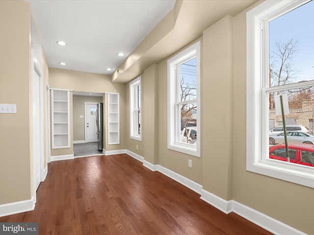 entrance foyer with hardwood / wood-style flooring, recessed lighting, and baseboards