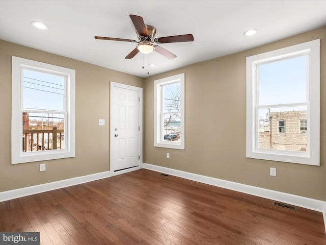 entryway with recessed lighting, visible vents, baseboards, and dark wood-style floors