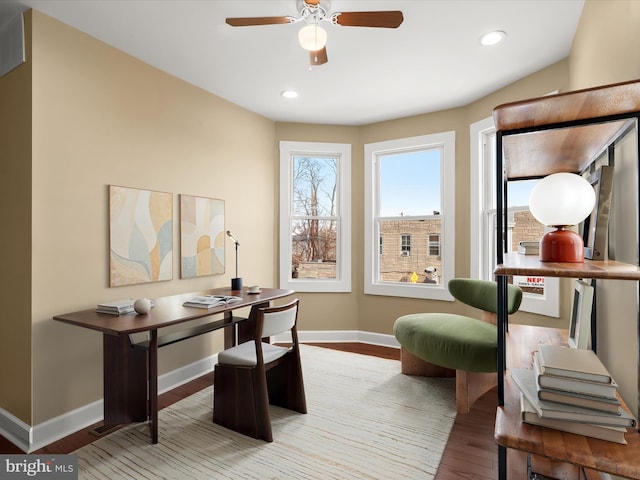 office featuring recessed lighting, a ceiling fan, baseboards, and wood finished floors