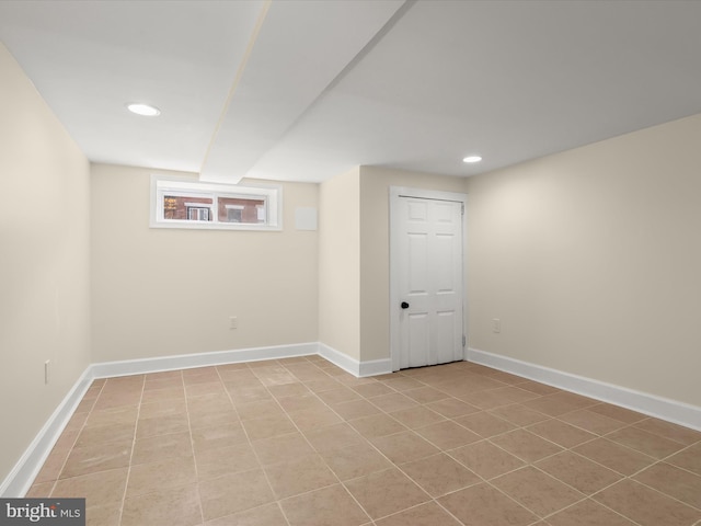 basement with recessed lighting and baseboards