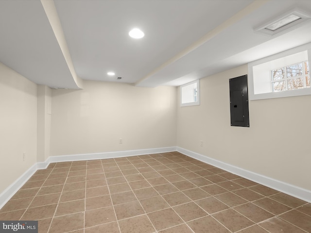 below grade area featuring electric panel, recessed lighting, and baseboards