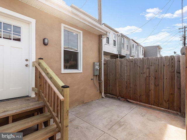 view of patio featuring fence