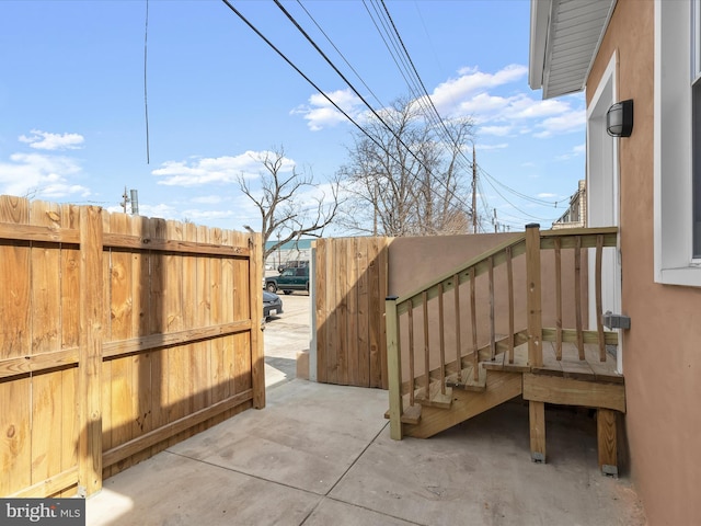 view of patio featuring fence