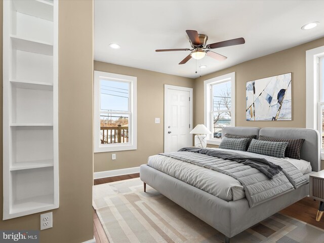 bedroom with recessed lighting, baseboards, wood finished floors, and a ceiling fan