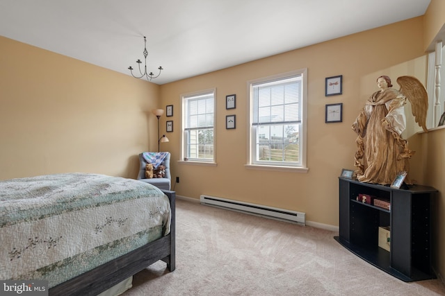 bedroom featuring baseboards, baseboard heating, and carpet floors