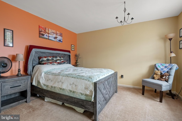 carpeted bedroom featuring baseboards