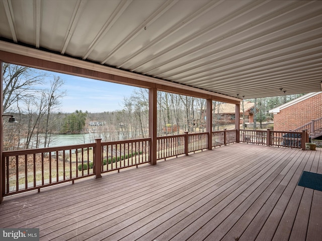 deck featuring a water view