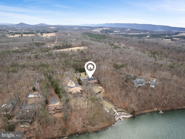 drone / aerial view featuring a water and mountain view