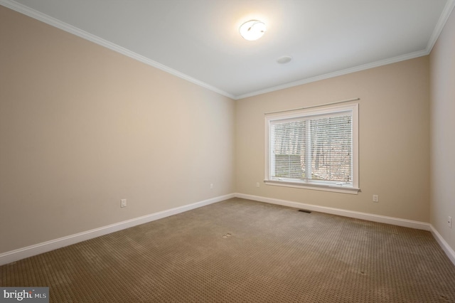 unfurnished room featuring carpet, crown molding, visible vents, and baseboards