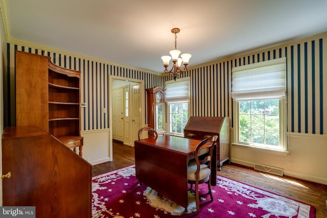 office area with visible vents, wallpapered walls, baseboards, an inviting chandelier, and wood finished floors