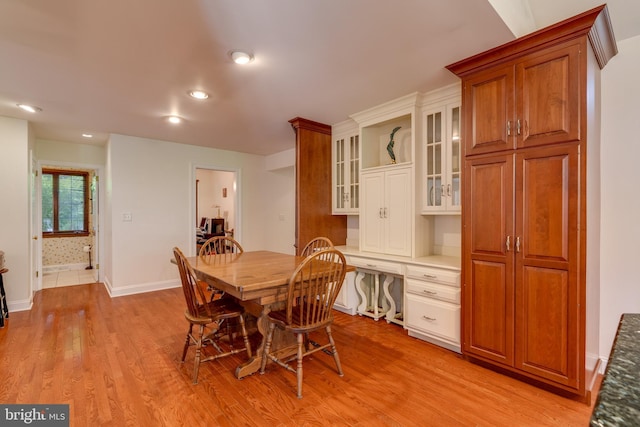 dining area with recessed lighting, light wood-type flooring, baseboards, and built in study area