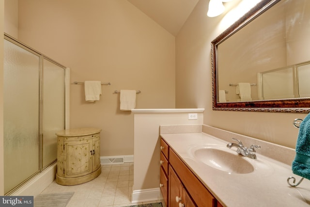 full bath featuring visible vents, lofted ceiling, a shower with shower door, tile patterned floors, and vanity