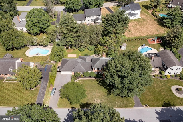 birds eye view of property with a residential view