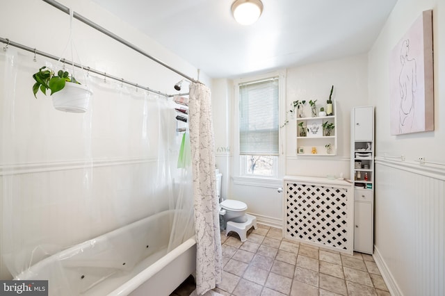 bathroom featuring toilet and shower / bath combo