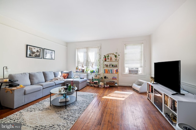 living room with hardwood / wood-style floors and radiator heating unit