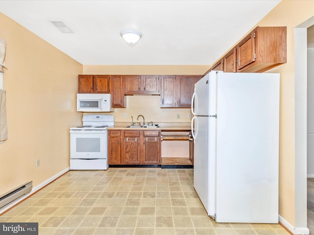 kitchen with white appliances, visible vents, a baseboard radiator, a sink, and light countertops