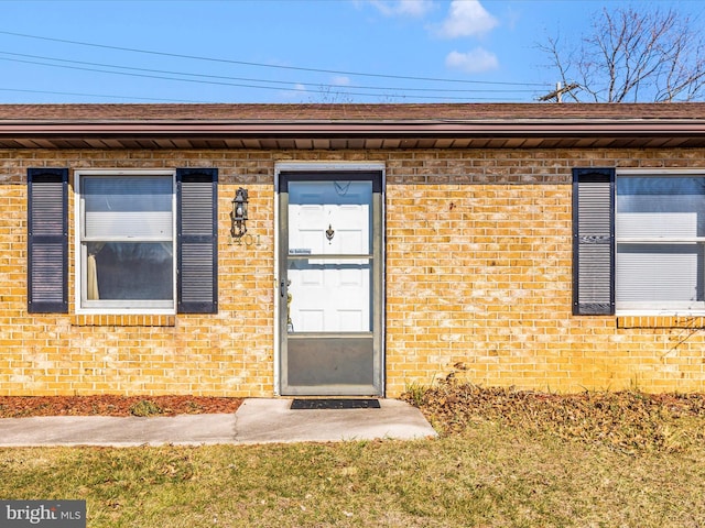 entrance to property with brick siding