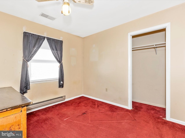 unfurnished bedroom featuring a baseboard heating unit, carpet, visible vents, and baseboards