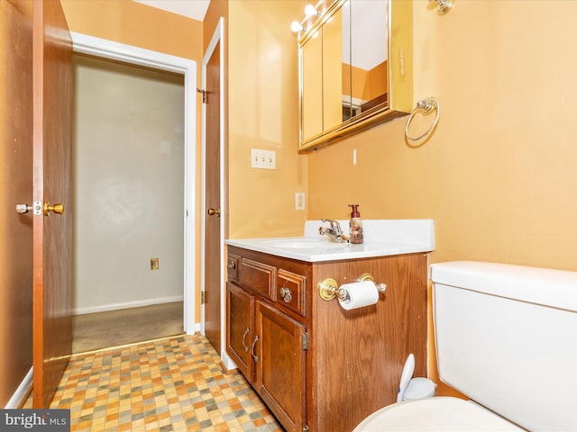 bathroom with toilet and vanity