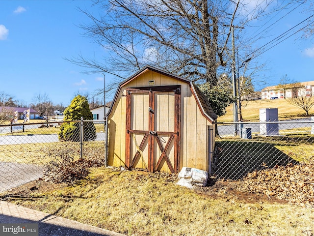 view of shed with fence