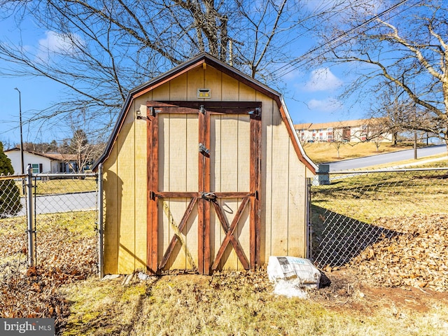 view of shed with fence