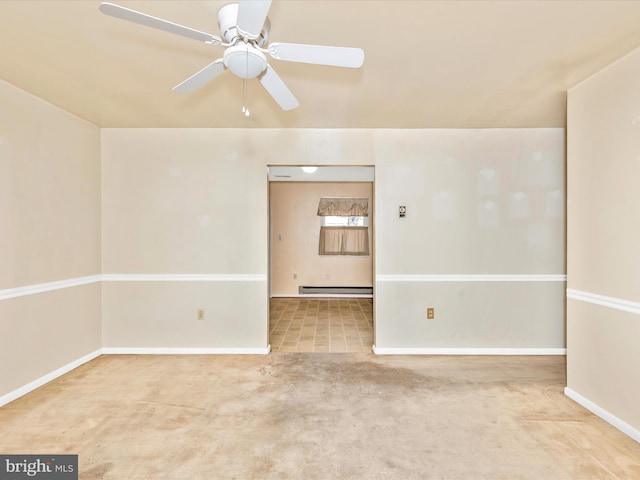 spare room with a baseboard radiator, baseboards, a ceiling fan, and carpet floors