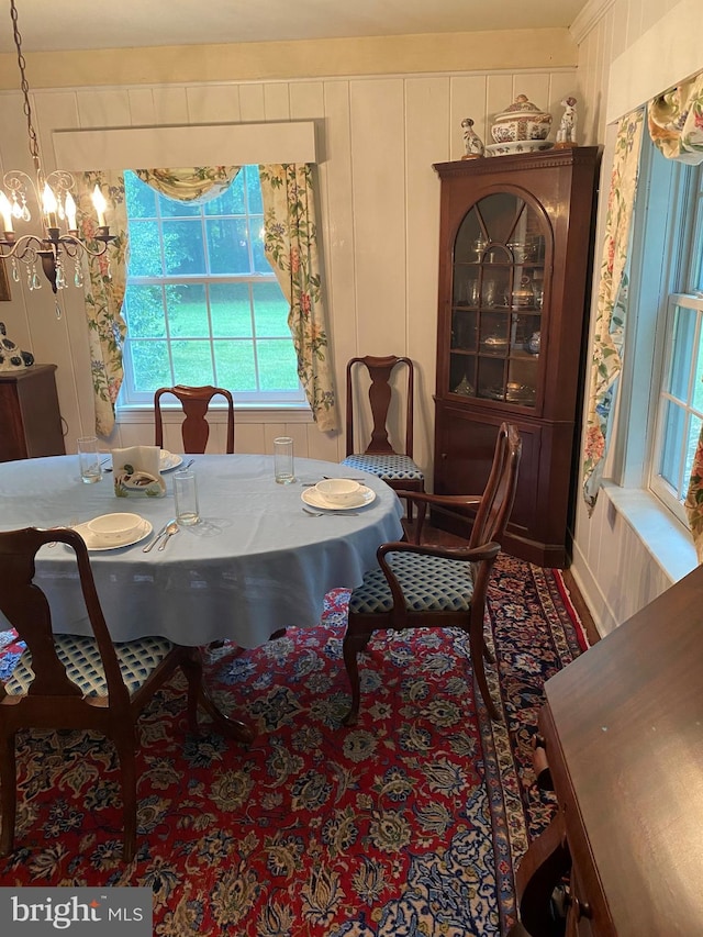 dining space featuring a decorative wall