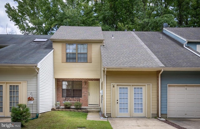 multi unit property featuring brick siding and a shingled roof