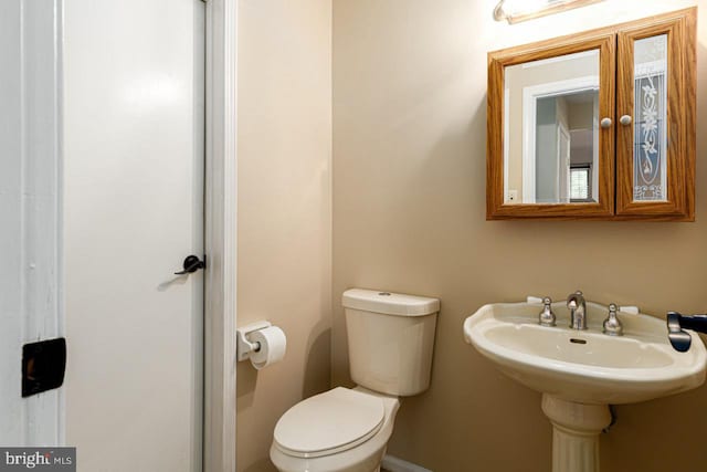 half bathroom with toilet