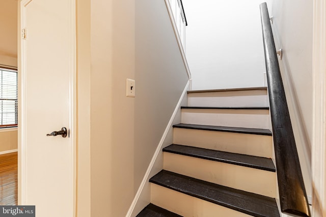 stairs featuring baseboards