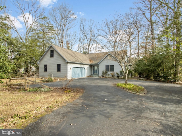 view of front of home with driveway and an attached garage