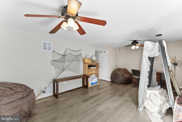 interior space featuring wood finished floors and visible vents