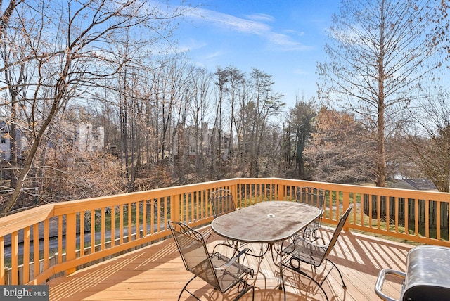 wooden deck featuring outdoor dining space