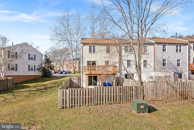 back of house with a yard, a fenced backyard, and a residential view