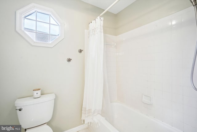 full bathroom with toilet and shower / bath combination with curtain