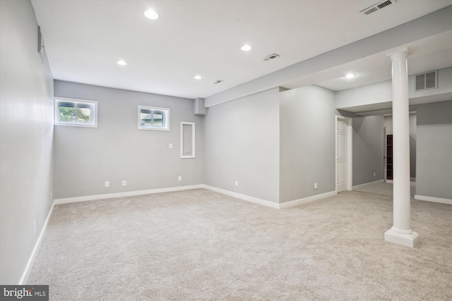 basement with carpet floors, visible vents, and recessed lighting