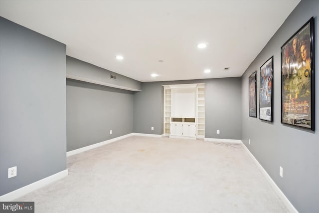 basement featuring baseboards, carpet floors, and recessed lighting