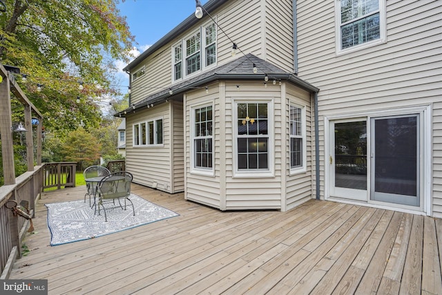 wooden deck with outdoor dining area